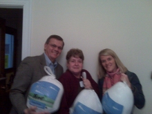 Left to right: Paul Barry, President – Joanna of the Braintree Food Pantry – Kelly Minichello Director Business Operations